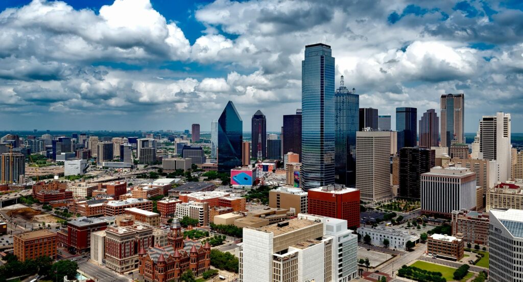 Texas cityscape with tall modern buildings representing Austin's growing tech and business hubs